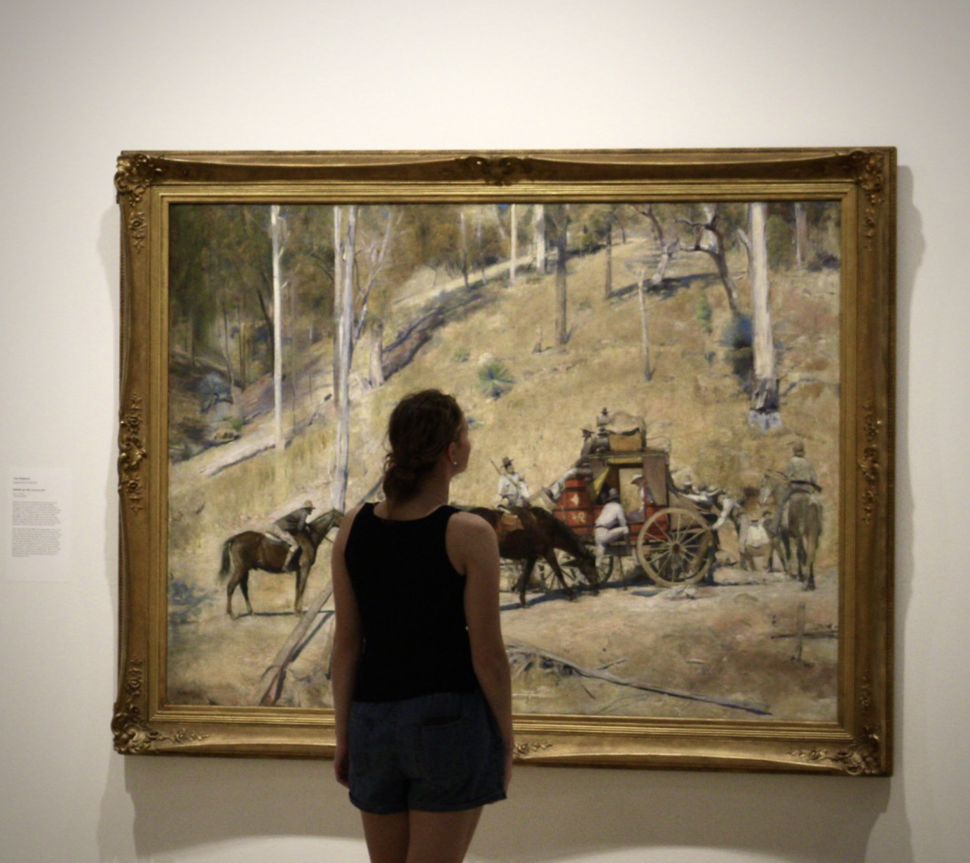 Nia Isabella viewing art in a gallery